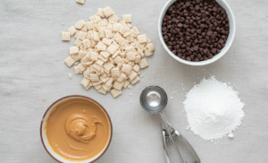 ngredients and a cookie scoop needed to make easy, uniform Puppy Chow balls at home.