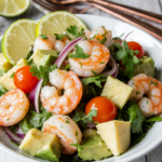 Vibrant shrimp avocado salad with grilled shrimp and creamy avocado in a white bowl - fresh and healthy meal