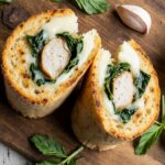 Golden-brown toasted chicken wraps with garlic and cheese sliced open to reveal melted cheese and tender chicken, the ultimate easy dinner recipe.