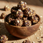 A rustic wooden bowl filled with homemade quinoa chocolate clusters, featuring crunchy quinoa, dark chocolate, almonds, and pumpkin seeds.